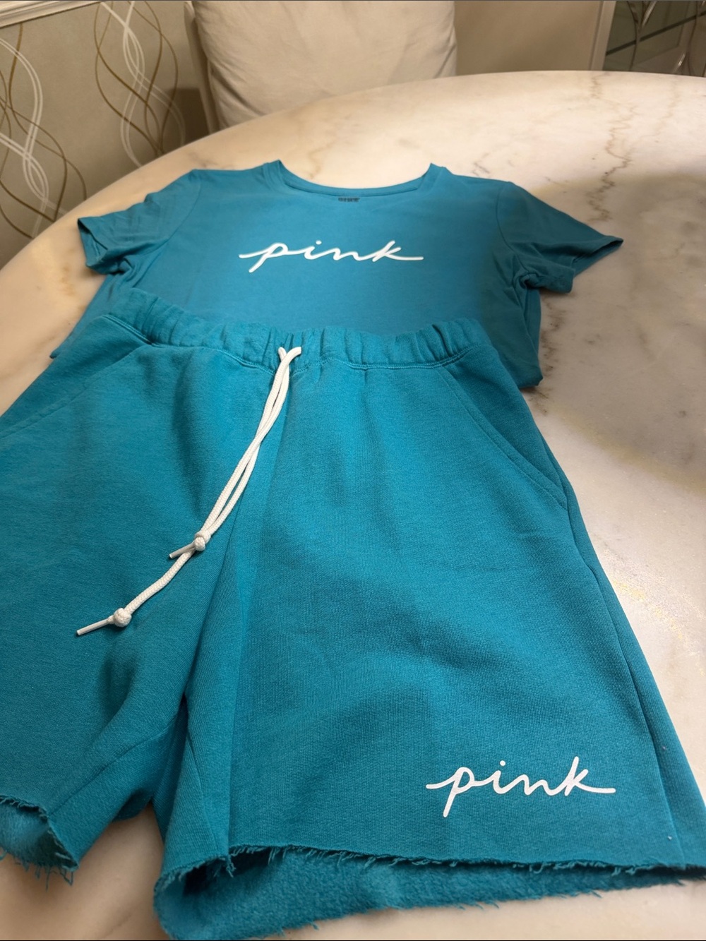 Victoria’s Secret pink sweat shorts and T-shirt never worn new without tags .